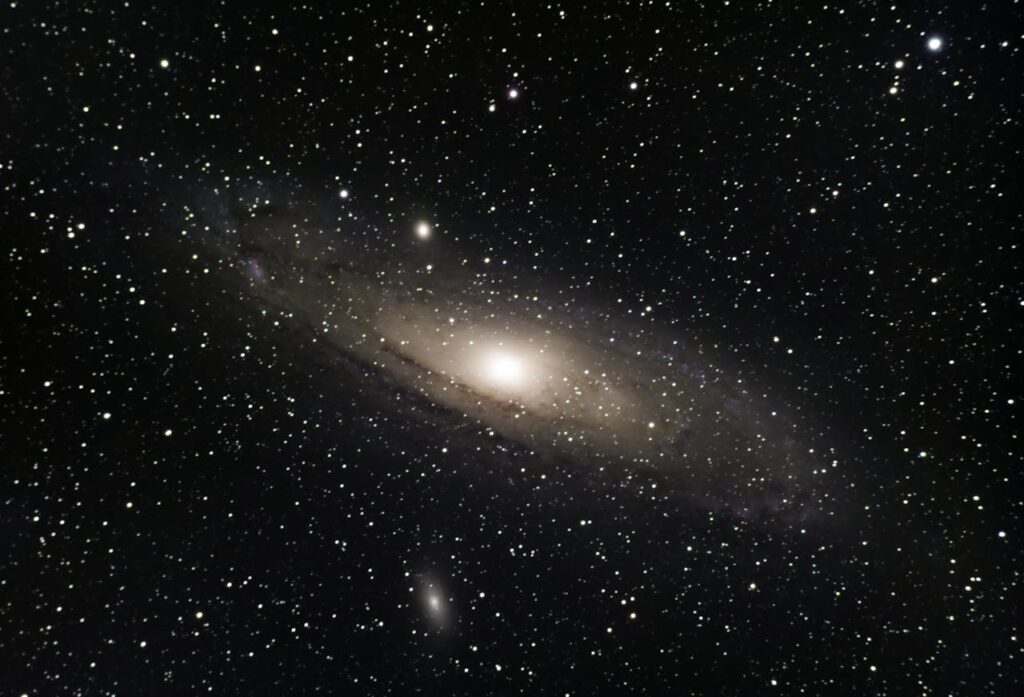 Stunning view of the Andromeda Galaxy surrounded by countless stars in outer space.
